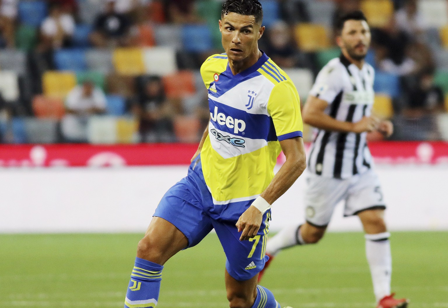 Juventus&#039; Cristiano Ronaldo goes for the ball during the Serie A soccer match between Udinese and Juventus, at the Dacia Arena in Udine, Italy, Sunday, Aug. 22, 2021. (Andrea Bressanutti/LaPresse ...