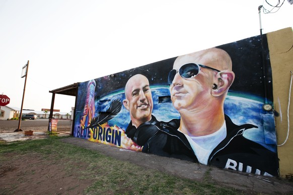 A mural by Fernandezgraphics of Blue Origin and Amazon founder Jeff Bezos is seen on the wall of a building Tuesday in Van Horn, Texas. Bezos has blasted into space on his rocket company���s first fli ...