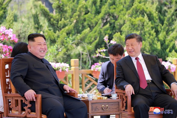 FILE - In this May 8, 2018, file photo provided by the North Korean government, North Korean leader Kim Jong Un, left, meets Chinese President Xi Jinping in Dalian, China. After a few months of rappro ...