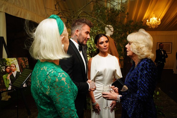 The King And Queen Attend A UK-Italy Dinner To Celebrate The Slow Food And Slow Fashion Movement Queen Camilla right talks with Dame Helen Mirren left and David and Victoria Beckham, during a dinner i ...