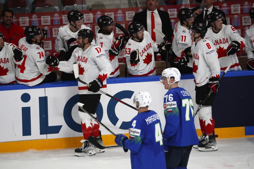 epa10626999 Players of Canada celebrate a goal during the preliminary round group B match between Slovenia and Canada at the IIHF Ice Hockey World Championship 2023 in Arena Riga, Latvia, 14 May 2023. ...