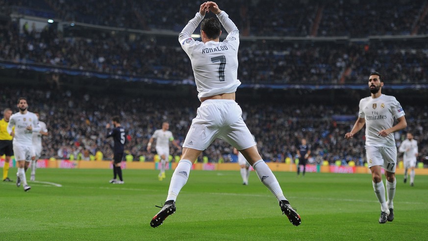 MADRID, SPAIN - DECEMBER 08: Cristiano Ronaldo of Real Madrid celebrates after scoring Real&#039;s 6th goal during the UEFA Champions League Group A match between Real Madrid CF and Malmo FF at the Sa ...