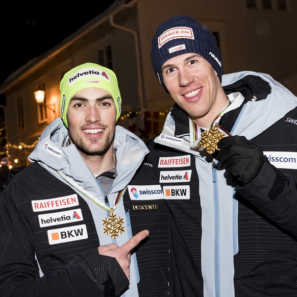 Gold medals, Daniel Yule, and Ramon Zenhaeusern of Switzerland, from left to right, poses after the Alpine Team Event at the 2019 FIS Alpine Skiing World Championships in Are, Sweden Tuesday, February ...