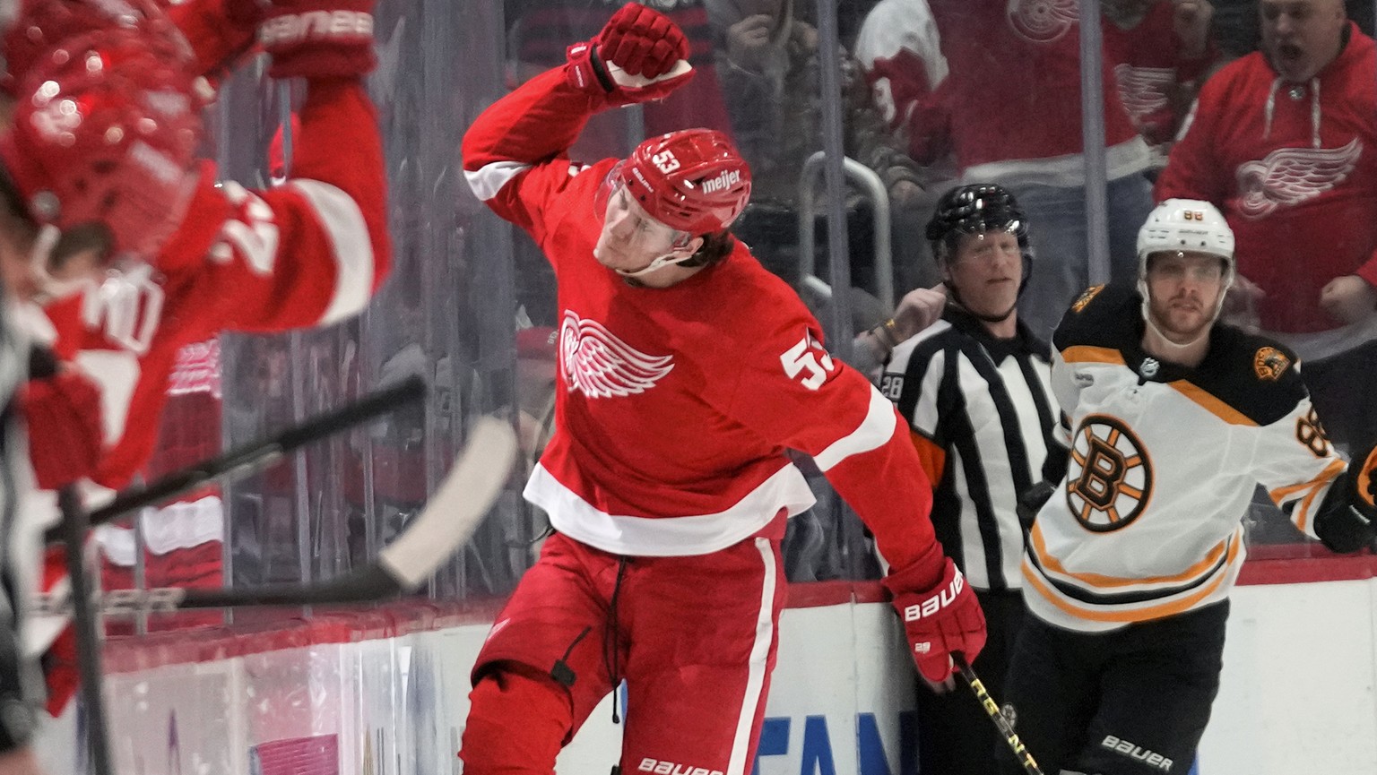 Detroit Red Wings defenseman Moritz Seider (53) celebrates his goal against the Boston Bruins in the second period of an NHL hockey game Sunday, March 12, 2023, in Detroit. (AP Photo/Paul Sancya)