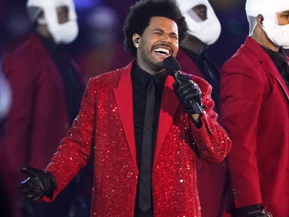 FILE - The Weeknd performs during the halftime show of the NFL Super Bowl 55 football game between the Kansas City Chiefs and Tampa Bay Buccaneers, on Feb. 7, 2021, in Tampa, Fla. The Weeknd is nomina ...