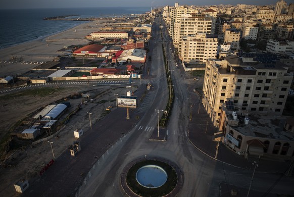 FILE - This Dec. 18, 2020 file photo shows an empty main road in Gaza City. Qatar pledged $60 million on Thursday, Feb. 25, 2021, to help construct a natural gas pipeline running from Israel into the  ...