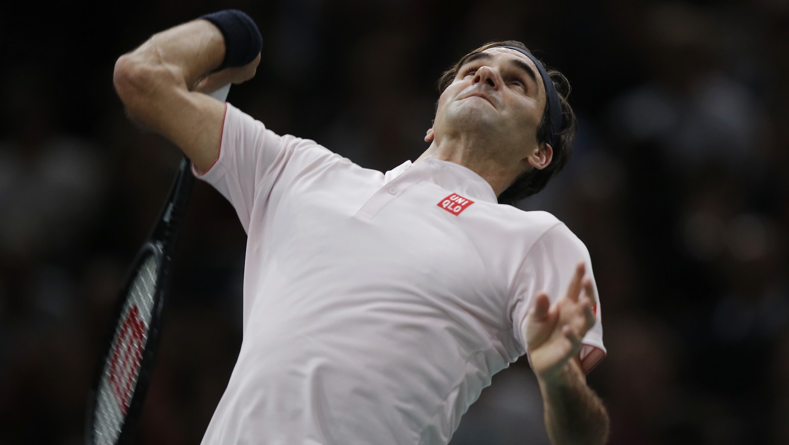 Roger Federer of Switzerland serves the ball to Fabio Fognini of Italy during their third round match of the Paris Masters tennis tournament at the Bercy Arena in Paris, France, Thursday, Nov. 1, 2018 ...