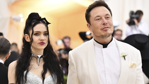 Grimes, left, and Elon Musk attend The Metropolitan Museum of Art&#039;s Costume Institute benefit gala celebrating the opening of the Heavenly Bodies: Fashion and the Catholic Imagination exhibition  ...