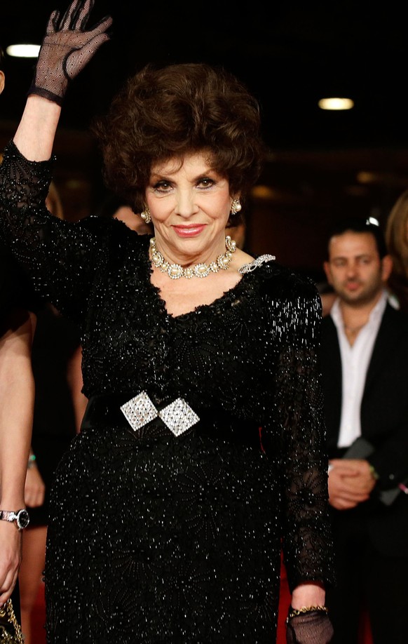 FILE - In this Nov. 16, 2012 file photo, actresses Gina Lollobrigida poses for photographers as they arrive for the screening of a documentary on Miss Italy during the 7th edition of the Rome Internat ...