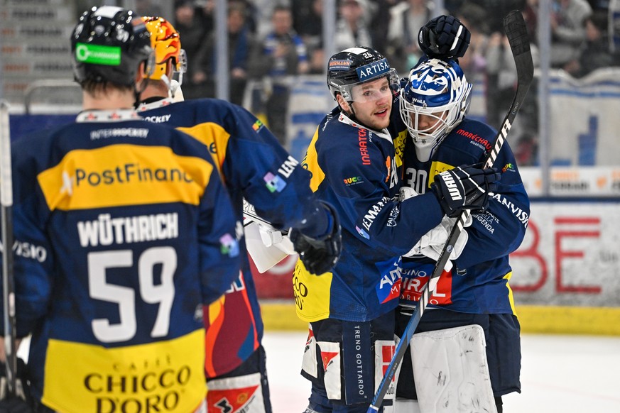 KEYPIX - Simone Terraneo (HCAP) middle and goalie Janne Juvonen (HCAP) right celebrate the victory, during the play-in game of National League A (NLA) Swiss Championship 2024/25 between HC Ambri Piott ...
