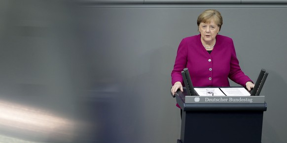 German Chancellor Angela Merkel delivers a speech during a meeting of the German federal parliament, Bundestag, at the Reichstag building in Berlin, Germany, Thursday, April 23, 2020. (AP Photo/Michae ...