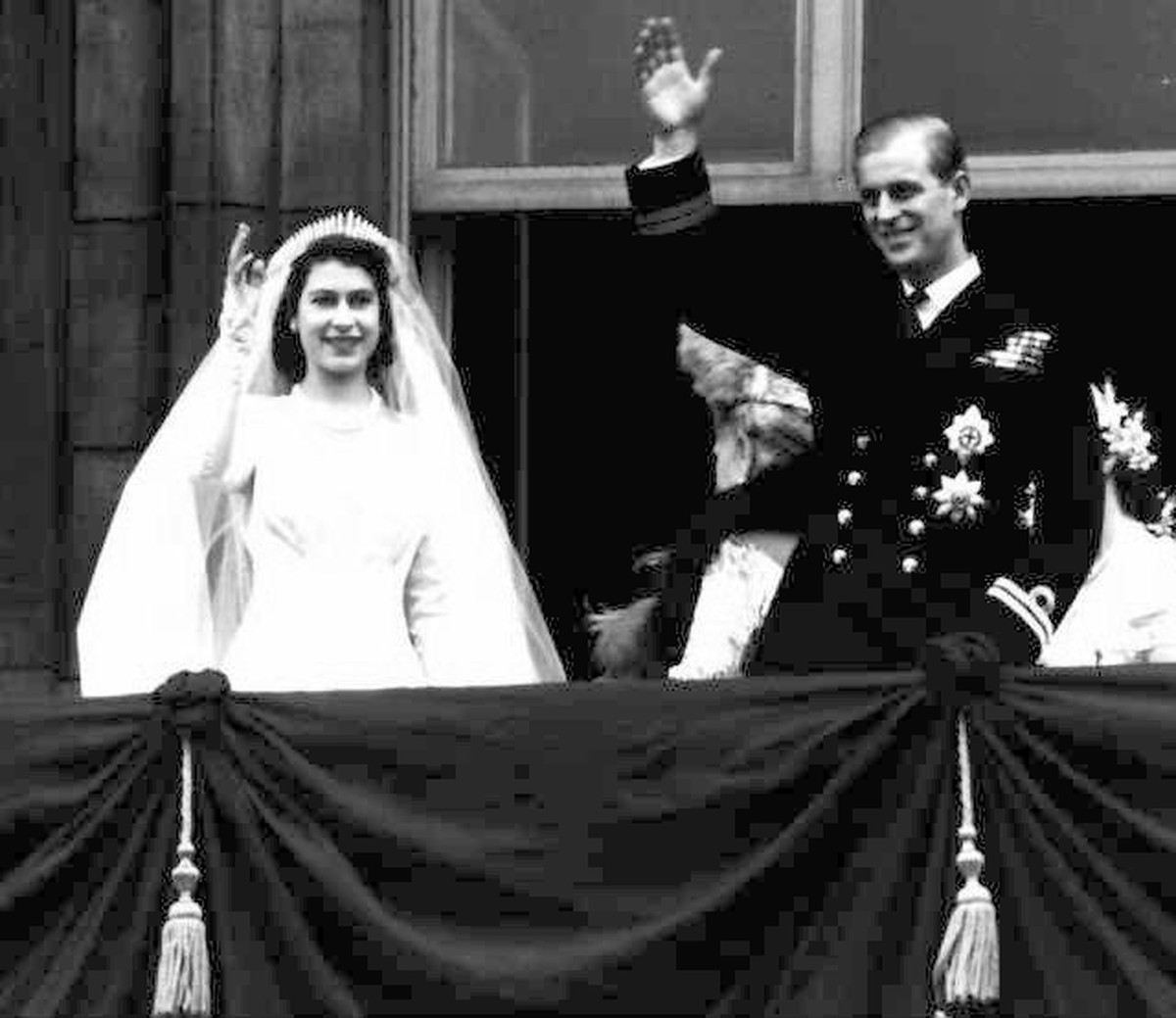 Britain's Queen Elizabeth II and her husband Prince Philip, wave from the balcony of London's Buckingham Palace, following their wedding at Westminster Abbey, in this November 20, 1947 file  ...