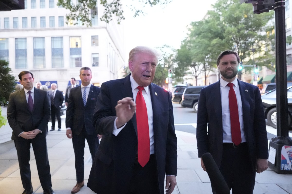 President Donald Trump speaks to reporters before he enters a restaurant near the White House, Tuesday, Sept. 9, 2025, in Washington, to have dinner with Secretary of State Marco Rubio, Defense Secret ...