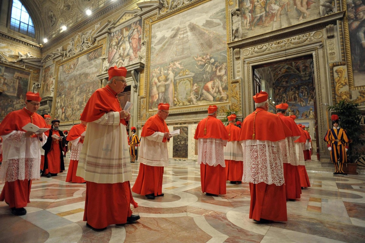 epa03620628 A handout picture released by the Osservatore Romano shows Cardinals entering in the Sistine Chapel before the start of the conclave at the Vatican on 12 March 2013. The Catholic Church&am ...