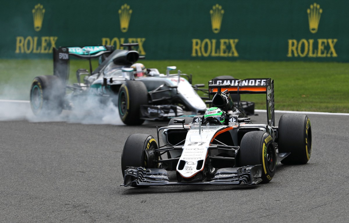 Belgium Formula One - F1 - Belgian Grand Prix 2016 - Francorchamps, Belgium - 28/8/16 - Force India's Nico Hulkenberg of Germany leads the race ahead of Mercedes' Lewis Hamilton of Britain d ...