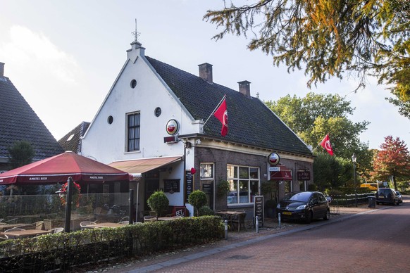 epa07927413 An exterior view of the local pub De Kastelein in the village of Ruinerwold, Drenthe, the Netherlands, 17 October 2019. According to media reports, a father and his six children had been l ...