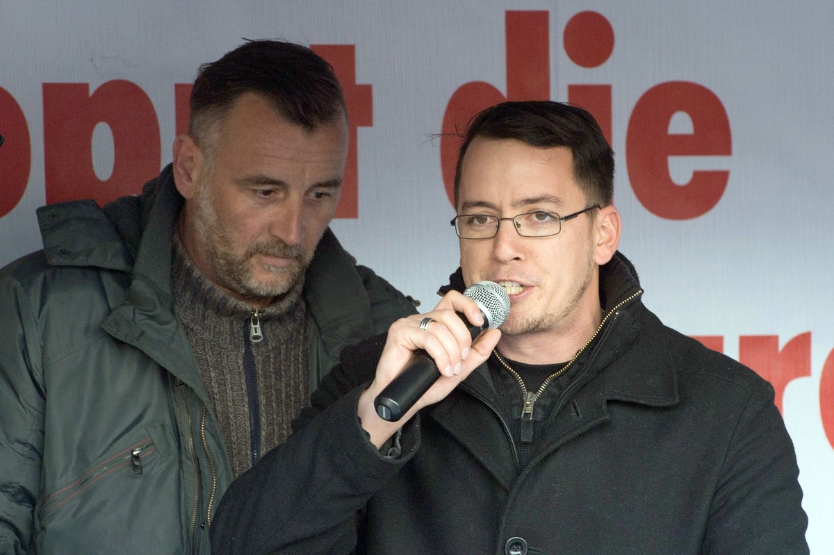 epa04693688 Swiss right-wing politician Ignaz Bearth (R) speaks beside Pegida movement initiator, Lutz Bachmann, during a demonstration at Altmarkt in Dresden, Germany, 06 April 2015. The 'Patrio ...