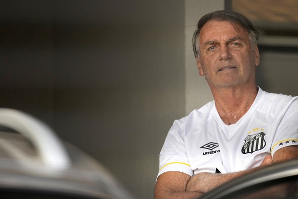Brazil&#039;s former President Jair Bolsonaro stands at the entrance to his home where he is under house arrest in Brasilia, Brazil, Friday, Aug. 29, 2025. (AP Photo/Eraldo Peres)
Jair Bolsonaro