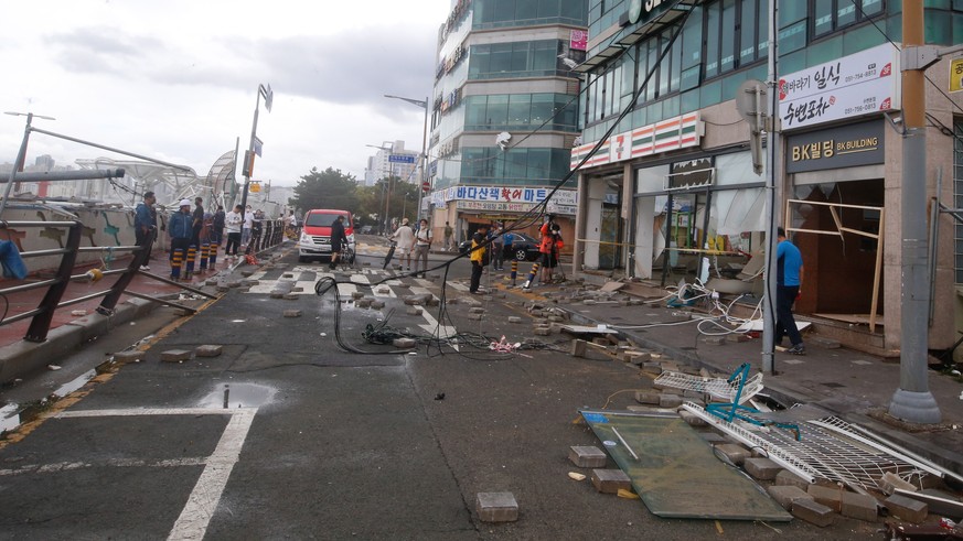 epa10163006 Damage in a street, caused by Typhoon Hinnamnor in Busan, South Korea, 06 September 2022. Typhoon Hinnamnor was the 11th typhoon that occurred in 2022, and is a super typhoon that formed o ...