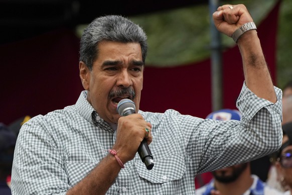 Venezuela&#039;s President Nicolas Maduro addresses government loyalists gathered at the presidential palace in support of his reelection one month after the presidential vote, in Caracas, Venezuela,  ...
