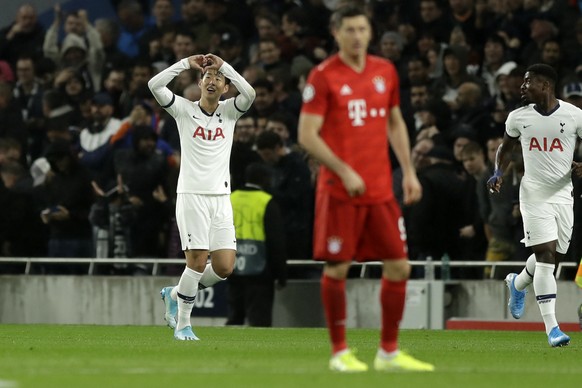 Tottenham&#039;s Son Heung-min, left, celebrates after scoring the opening goal of his team during the Champions League group B soccer match between Tottenham and Bayern Munich at the Tottenham Hotspu ...