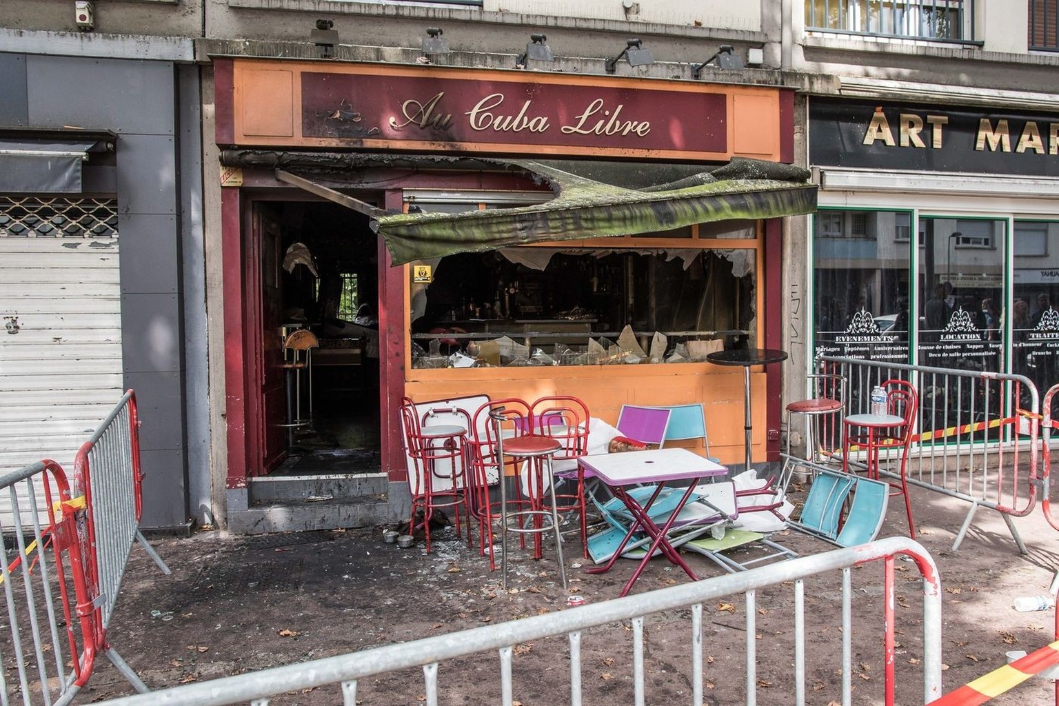 epa05458124 Fire damage is seen at the 'Au Cuba Libre' bar in Rouen, northern France, 06 August 2016. In the early hours of 06 august a fire broke out at a birthday party in the lower level  ...