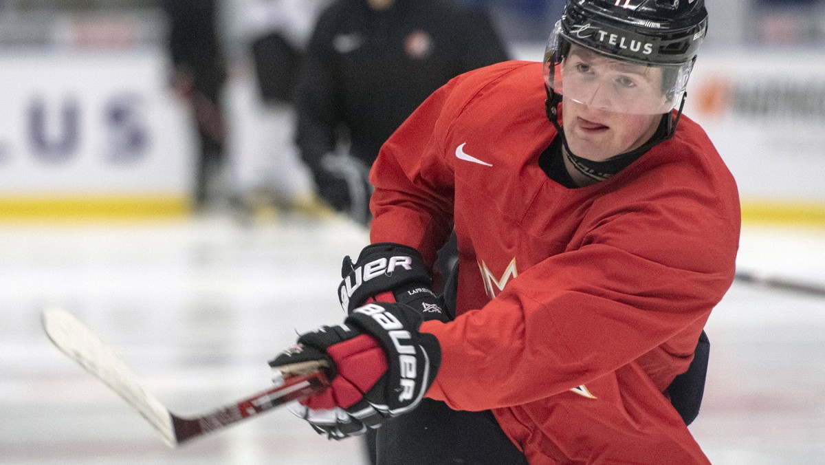 FILE - In this Jan. 1, 2020, file photo, Canada's Alexis Lafreniere shoots during the team's practice at the World Junior Hockey Championships in Ostrava, Czech Republic. The New York Ranger ...