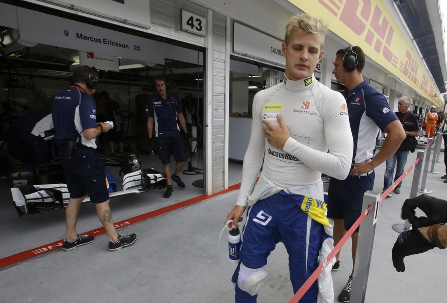 Sauber driver Marcus Ericsson, of Sweden, walks in the pit during the first practice session for Sunday&#039;s Formula One Hungary Grand Prix, at the Hungaroring racetrack, in Budapest, Hungary, Frida ...