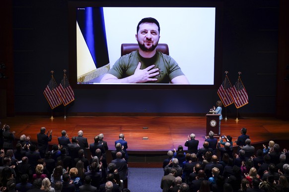 Speaker of the House Nancy Pelosi, D-Calif., introduces Ukrainian President Volodymyr Zelenskyy to speak to the U.S. Congress by video at the Capitol in Washington, Wednesday, March 16, 2022. (AP Phot ...