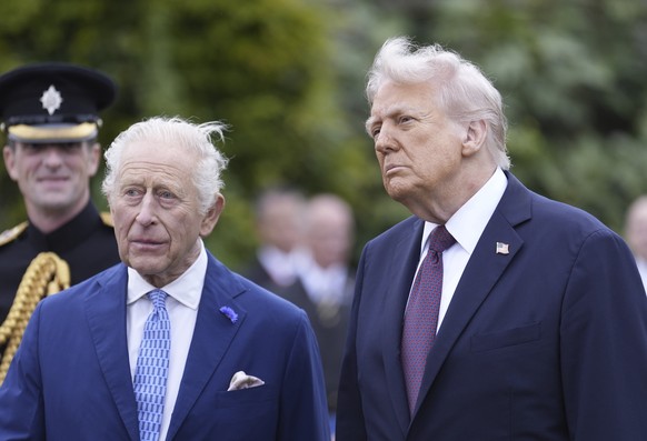 U.S. President Donald Trump, right, and Britain&#039;s King Charles attend a Beating Retreat military ceremony at Windsor Castle, England, on Wednesday Sept. 17, 2025, day one of U.S. President Donald ...
