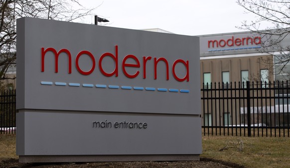 epa08247563 Signs at the main entrance for the biotech firm Moderna, are seen outside the company's Norwood facilities in Norwood, Massachusetts, USA 25 February 2020. Moderna has announced that ...