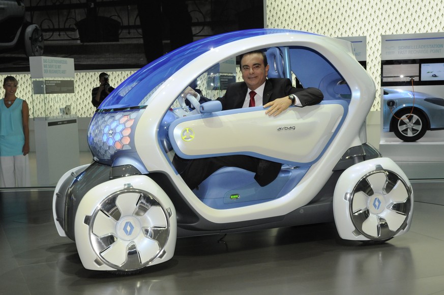 epa07177112 (FILE) - Then Renault CEO Carlos Ghosn poses in a zero emission concept vehicle Twizzy during a press preview day at the Frankfurt International Auto Show IAA in Frankfurt, 15 September 20 ...