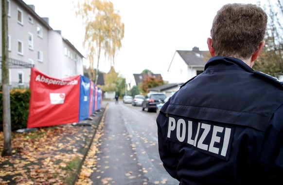 epa07978062 German police presence outside an appartment building in Detmold, Germany, 07 November 2019. According to police, a 15-year-old of Polish descent from Detmold stabbed and killed her three- ...