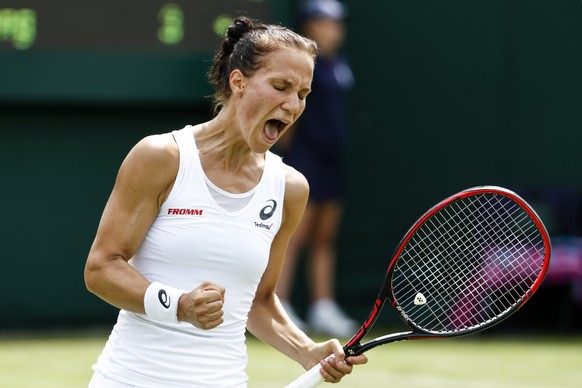 Viktorija Golubic of Switzerland celebrates during her first round match against Shuai Zhang of China, at the Wimbledon Championships at the All England Lawn Tennis Club, in London, Britain, 04 July 2 ...