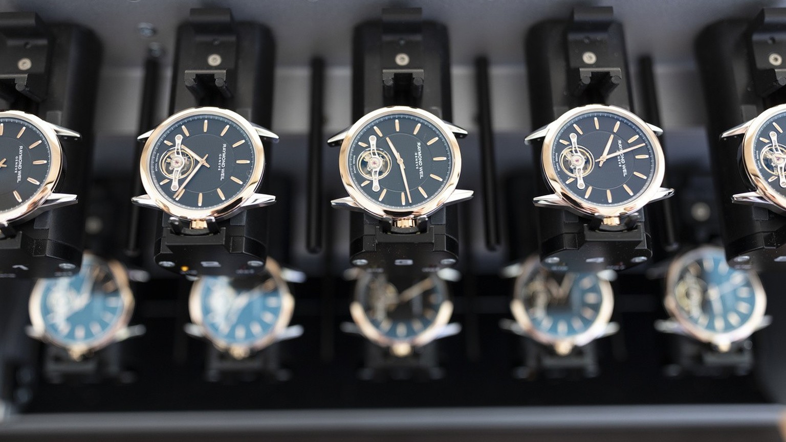 Watches from the Swiss luxury watch brand Raymond Weil on a device intended for a quality test, in Geneva, Switzerland, on October 8, 2018. (KEYSTONE/Gaetan Bally) Watches from the Swiss luxury watch brand...