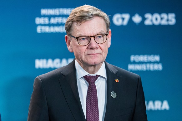 German Foreign Minister Johann Wadephul looks into the crowd ahead of the family photo during the G7 Foreign Ministers&#039; Meeting in Niagara-on-the-Lake, Ontario, Tuesday, Nov. 11, 2025. (Nick Iwan ...