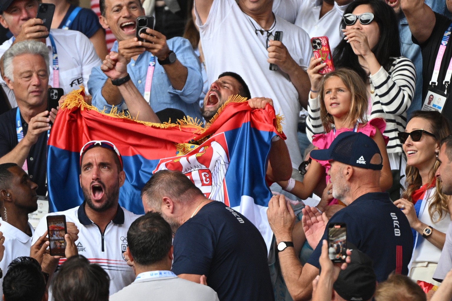 epa11525315 Novak Djokovic of Serbia celebrates with Viktor Troicki, daughter Tara and wife Jelena, after the Men Singles gold medal match against Carlos Alcaraz of Spain, of the Tennis competitions i ...
