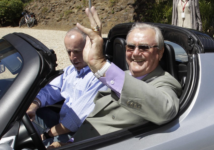 FILE - In this June 13, 2011, file photo, Denmark&#039;s Prince Henrik, right, waves as he drives a Tesla Roadster at the electric car maker&#039;s headquarters in Palo Alto, Calif. Denmark&#039;s roy ...