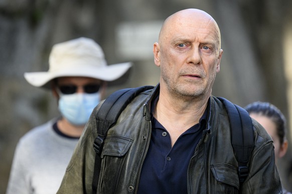 French-Swiss far-right writer Alain Soral, center, leaves the courthouse after his appeal trial for homophobia against a journalist, in Lausanne, Switzerland, Wednesday, September 27, 2023. (KEYSTONE/ ...