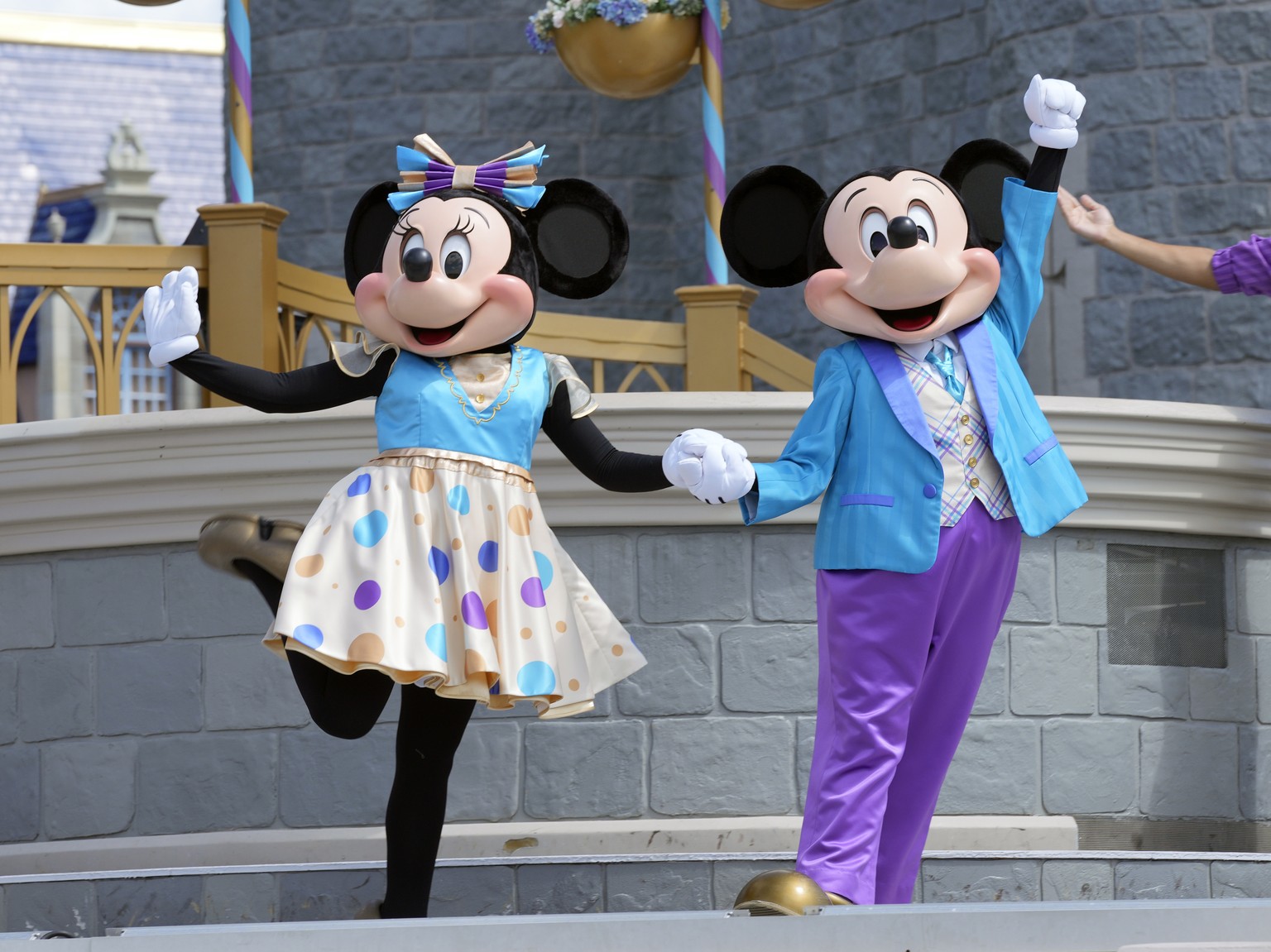 FILE - Minnie and Mickey Mouse perform for guests during a musical show in the Magic Kingdom at Walt Disney World, July 14, 2023, in Lake Buena Vista, Fla. Disney has requested a second court delay in ...