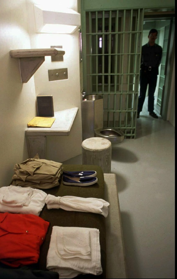 In this 1994 file photo, federal corrections officer William Brown stands in the doorway of a typical cell in a general population unit at the US Penitentiary, Administrative Maximum Security facility ...