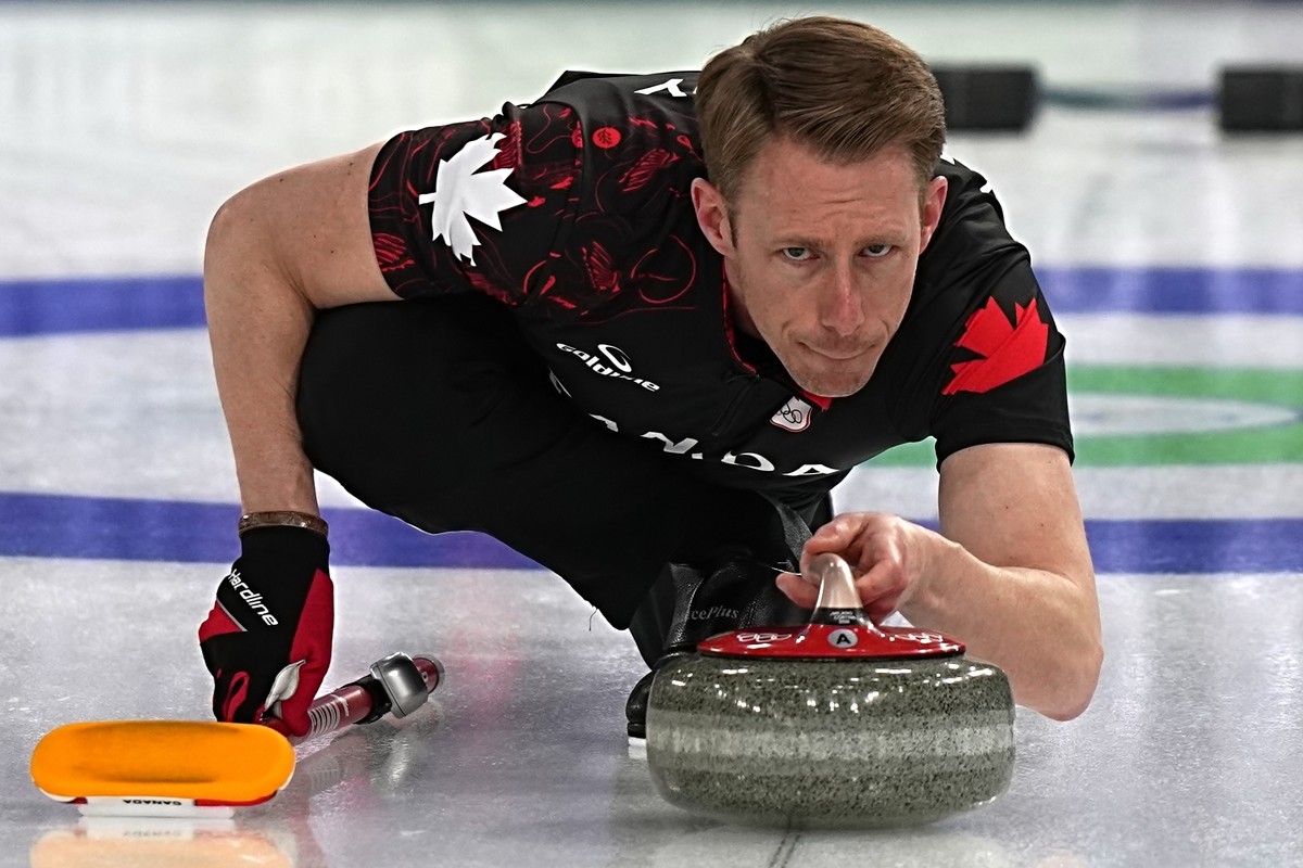 Canada's Marc Kennedy in action during the men's curling round robin session against the United States, at the 2026 Winter Olympics, in Cortina d'Ampezzo, Italy, Friday, Feb. 13, 2026.  ...