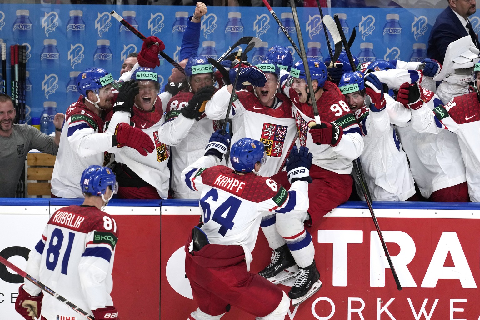 Members of during the Czech Republic team celebrate an empty-net goal by Czech Republic&#039;s David Kampf (64) during a gold medal match between Czech Republic and Switzerland at the Ice Hockey World ...