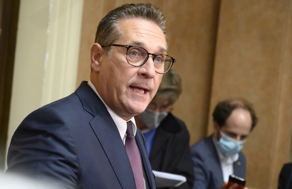 epa09432093 Heinz Christian Strache, former Austrian Vice Chancellor and former leader of the far-right Austrian Freedom Party (FPOe), addresses the media as he leaves after the verdict of his trial a ...