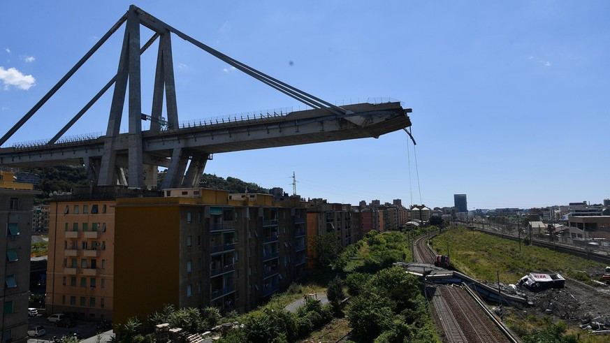 A view of the evacuated houses built under the remains part of the collapsed Morandi highway bridge, in Genoa, northern Italy, Wednesday, Aug. 15, 2018. A bridge on a main highway linking Italy with F ...