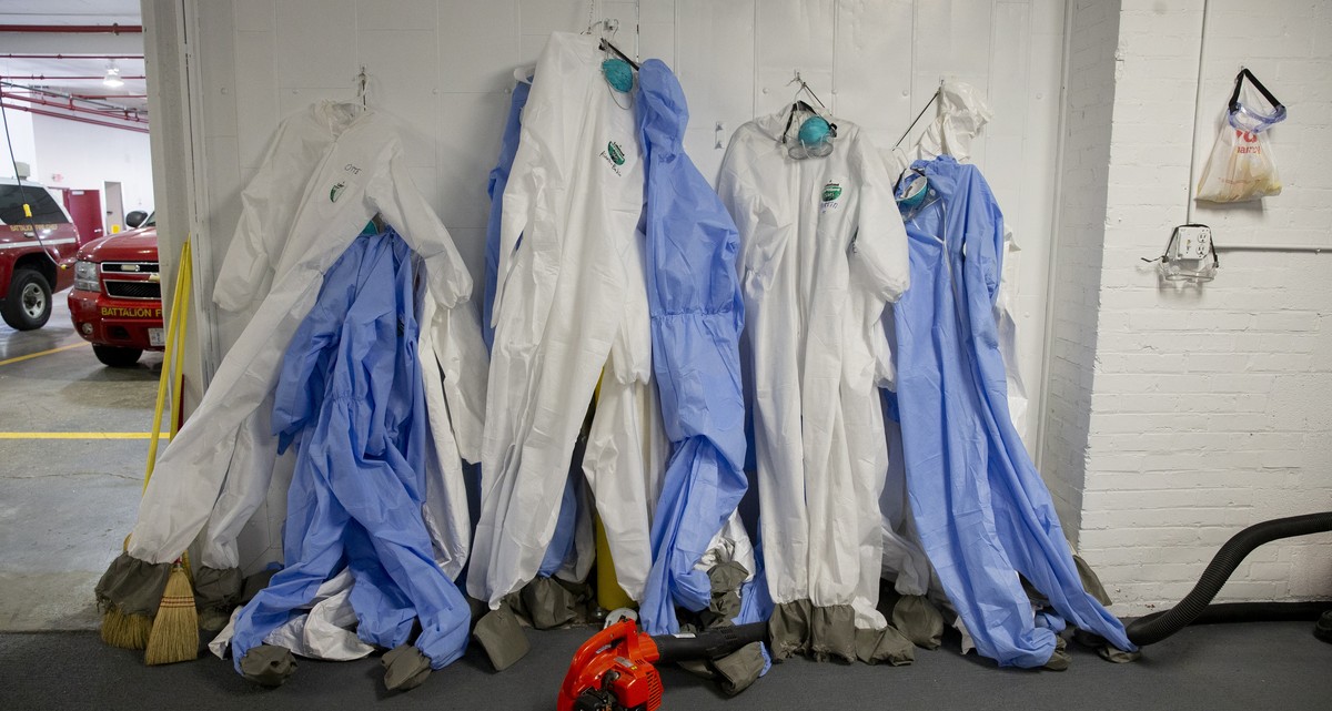 epa08364989 Biohazard suits are seen in a garage bay an at the District of Columbia Fire and Emergency Medical Services Department's (DC Fire and EMS) decontamination facility, in Washington, DC, ...