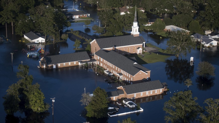 Floodwaters inundate a church after Hurricane Florence struck the Carolinas Monday, Sept. 17, 2018, in Conway, S.C. (AP Photo/Sean Rayford)