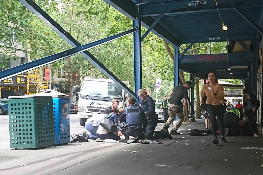 epa05732807 Police and emergency services at the scene after a car is believed to have hit pedestrians in Bourke Street Mall in Melbourne, Victoria, Australia, 20 January 2017. Ambulance Victoria said ...