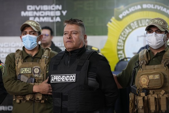 Bolivian police hold the detained Juan Jose Zuniga, former general commander of the Army, in La Paz, Bolivia, Wednesday, June 26, 2024. An apparent failed coup attempt erupted Wednesday in the country ...