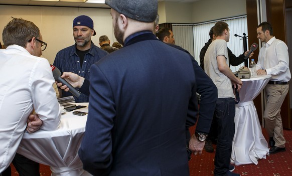 Reto von Arx, left, assistant coach of Switzerland&#039;s national ice hockey team, and Patrick Fischer, right, head coach of Switzerland&#039;s national ice hockey team, speak to the journalists, dur ...